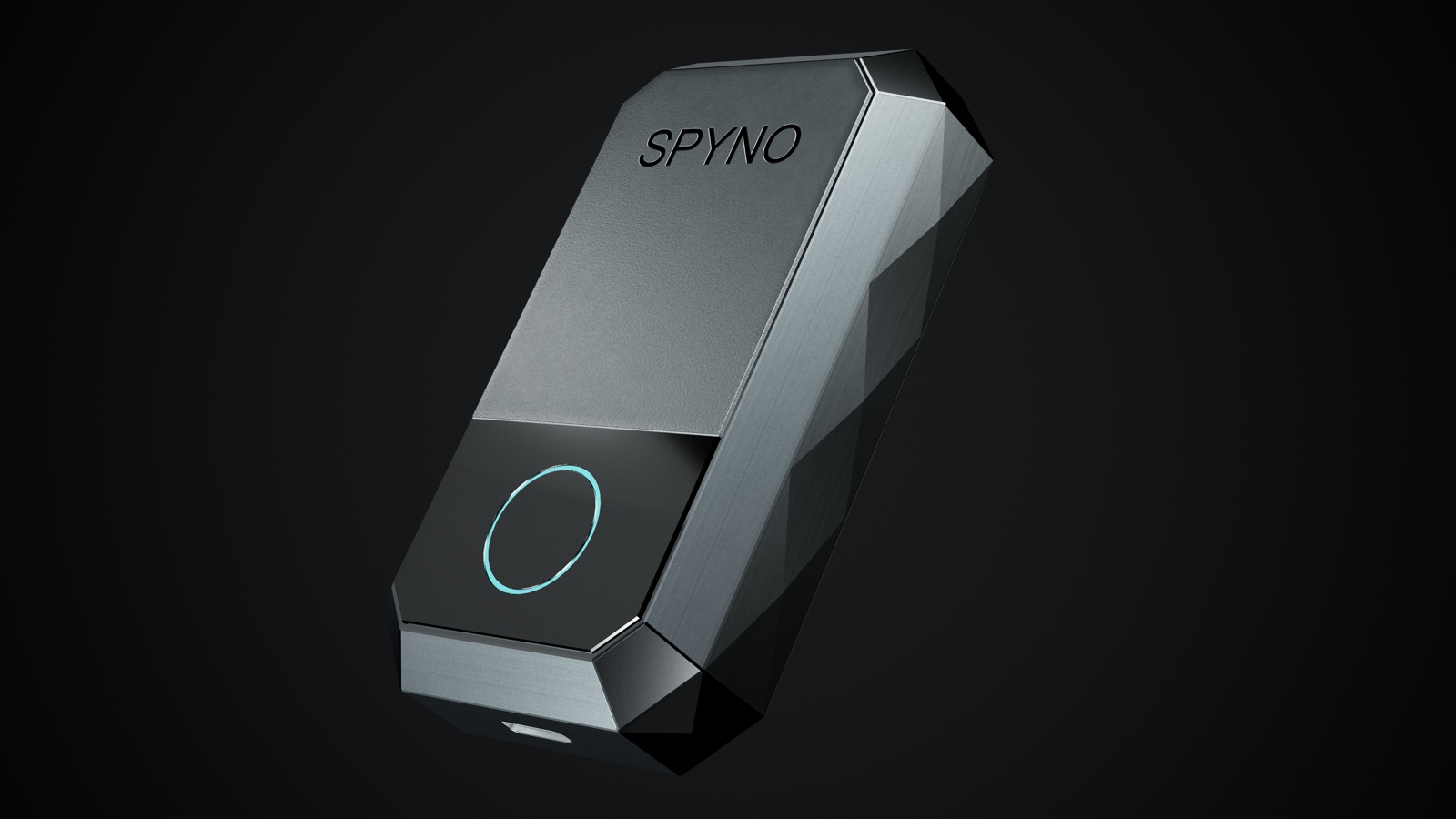 SPYNO — wearable counter-surveillance fob, machined aluminium chassis, signal-cyan status ring, engraved monogram.